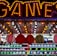 A brightly lit carnival game stall with a large 'GAMES' sign at the top surrounded by red and yellow lights. Various sports balls, including basketballs and soccer balls, are hanging from the ceiling and neatly arranged on shelves below.
